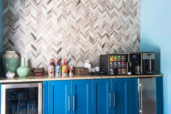 a kitchen with a counter top and a refrigerator at Elme Druid Hills, Atlanta, GA